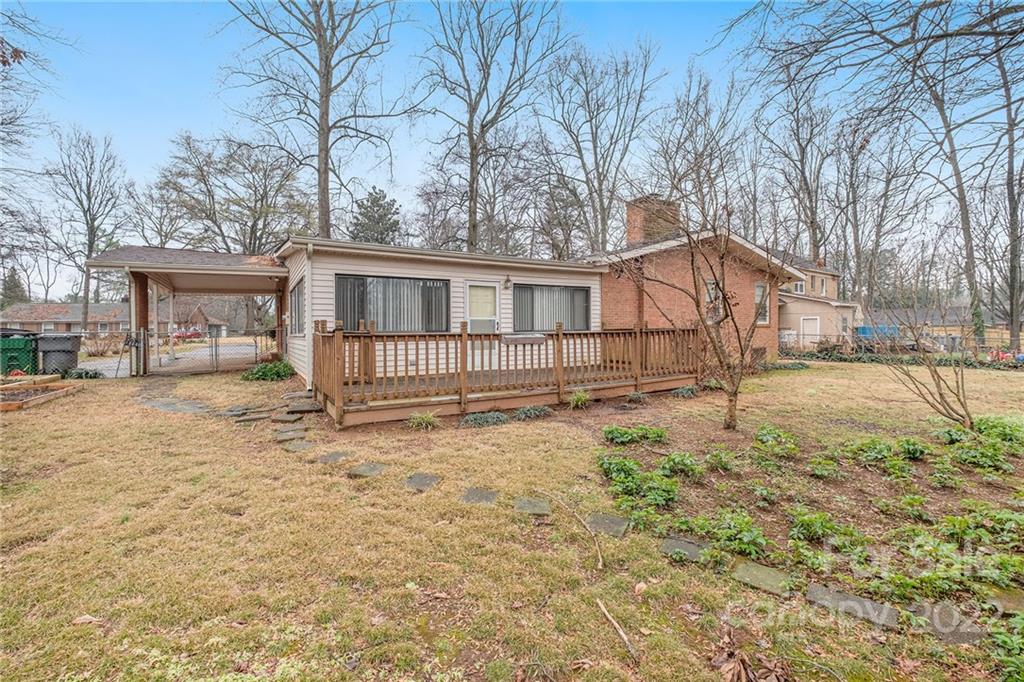 1446 McIlroy Road, Unit 8 Charlotte, NC 28212 - Photo 27 of 30 a view of a house with a yard