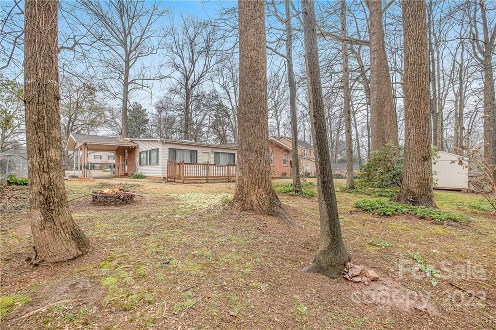 1446 McIlroy Road, Unit 8 Charlotte, NC 28212 - Photo 29 of 30 a house with trees in front of it