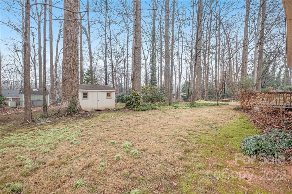 1446 McIlroy Road, Unit 8 Charlotte, NC 28212 - Photo 30 of 30 a house with trees in front of it