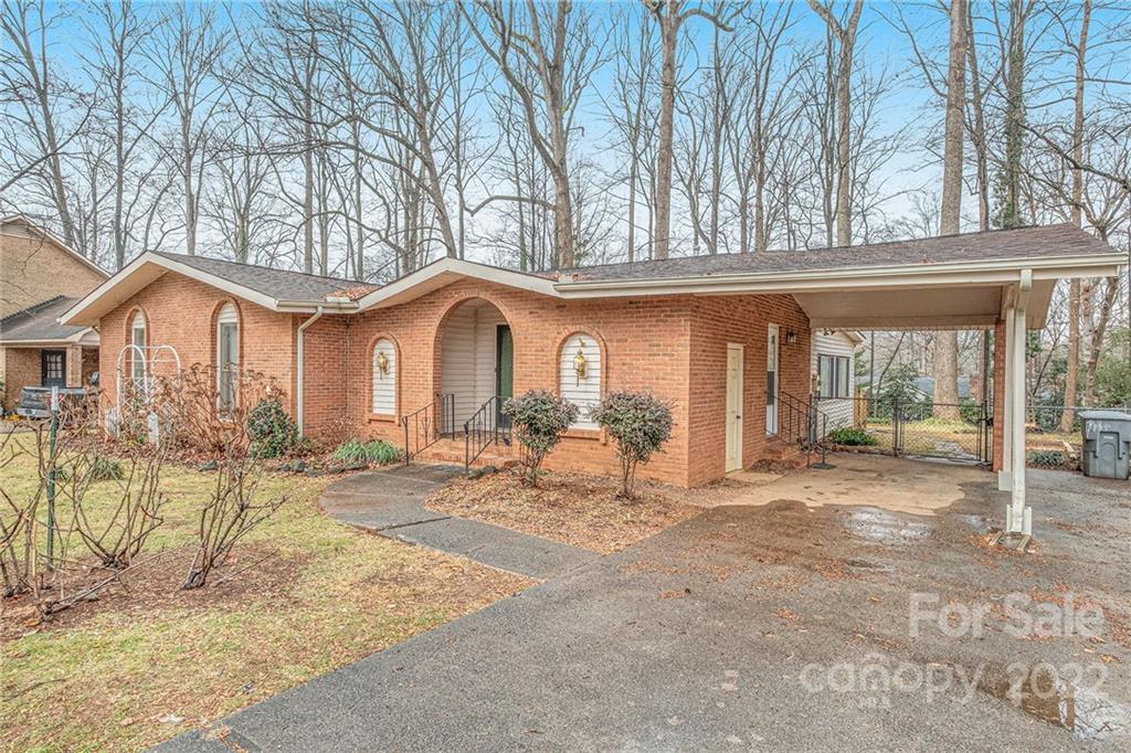 1446 McIlroy Road, Unit 8 Charlotte, NC 28212 - Photo 3 of 30 a front view of a house with a patio