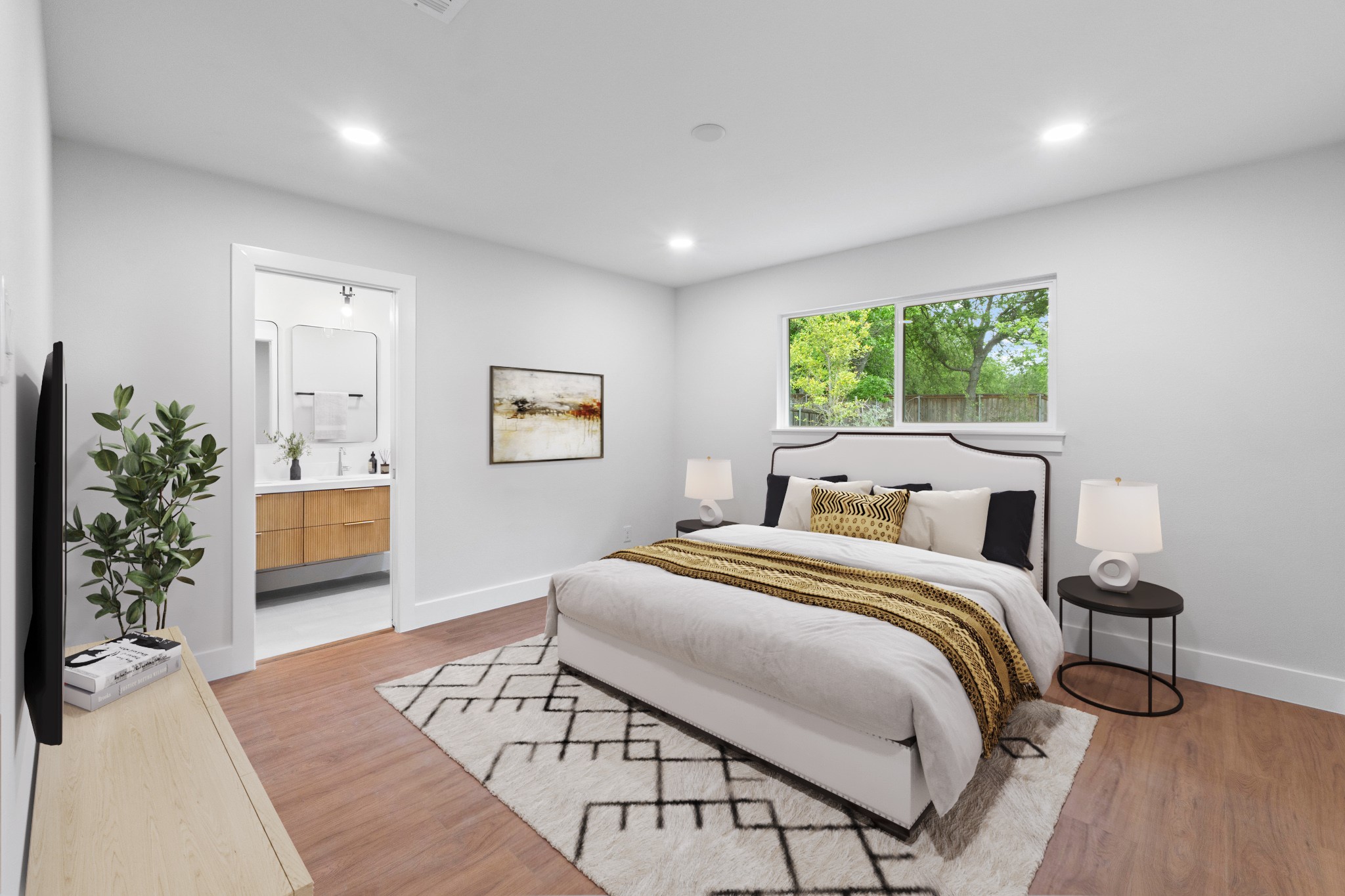 1608 Springer Lane Austin, TX 78758 - Photo 15 of 35 Bedroom featuring wood-finish flooring, recessed lighting, and a window overlooking greenery
