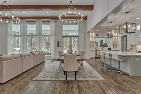 a large kitchen with a table and chairs