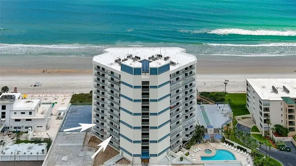 a tall building with a small yard