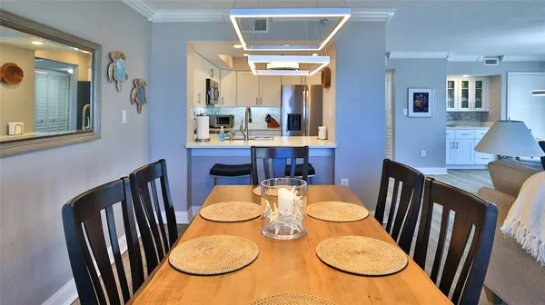 a living room with furniture ceiling fan and a rug