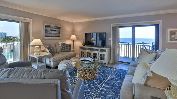 a bedroom with a bed and a potted plant