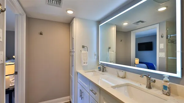 a view of a hallway with furniture and entryway