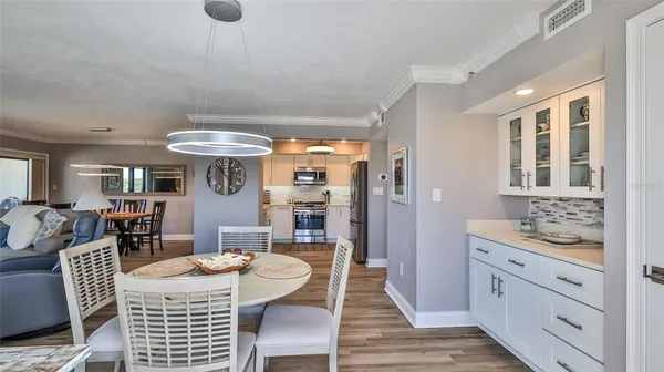 a kitchen with stainless steel appliances a refrigerator sink and microwave