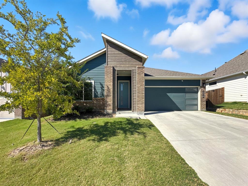 2216 Redwing Drive Denton, TX 76205 - Photo 2 of 38 a house view with a backyard space