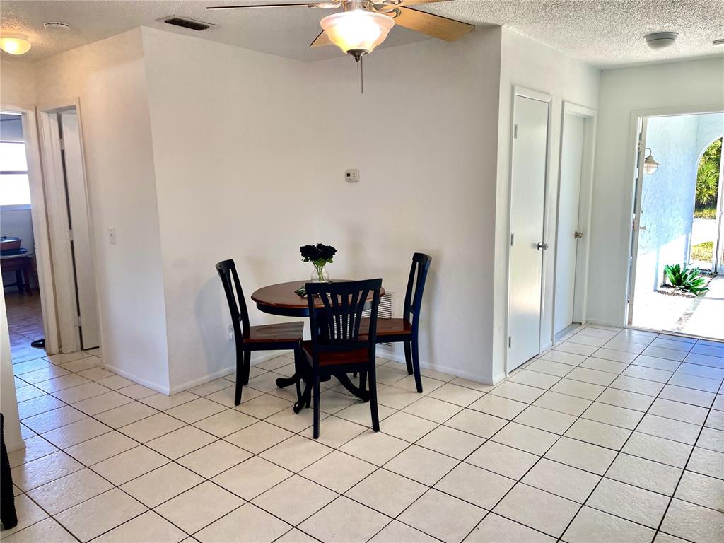 234 Shadow Street Northwest Port Charlotte, FL 33952 - Photo 12 of 48 a view of a dining room with furniture