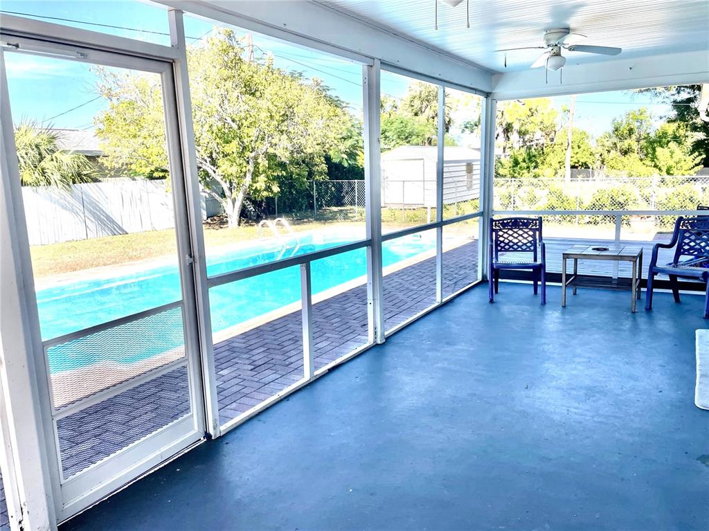 234 Shadow Street Northwest Port Charlotte, FL 33952 - Photo 14 of 48 a view of an empty room window and wooden floor