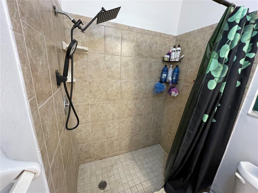 234 Shadow Street Northwest Port Charlotte, FL 33952 - Photo 30 of 48 a bathroom with a shower