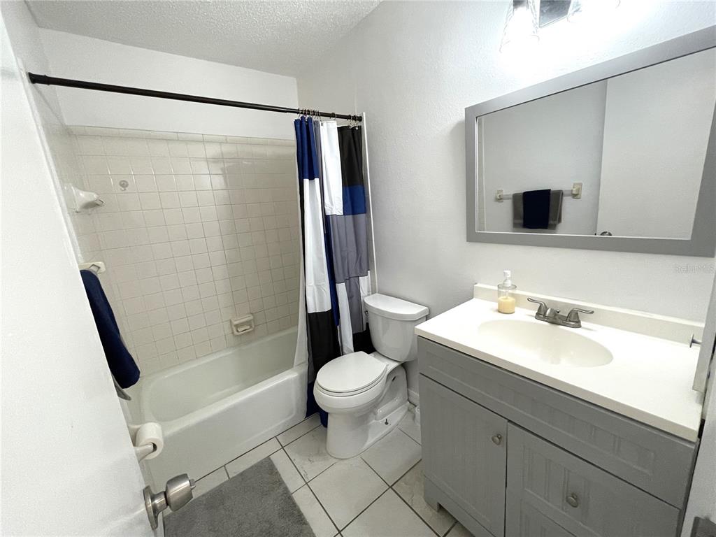 234 Shadow Street Northwest Port Charlotte, FL 33952 - Photo 33 of 48 a bathroom with a sink toilet and shower