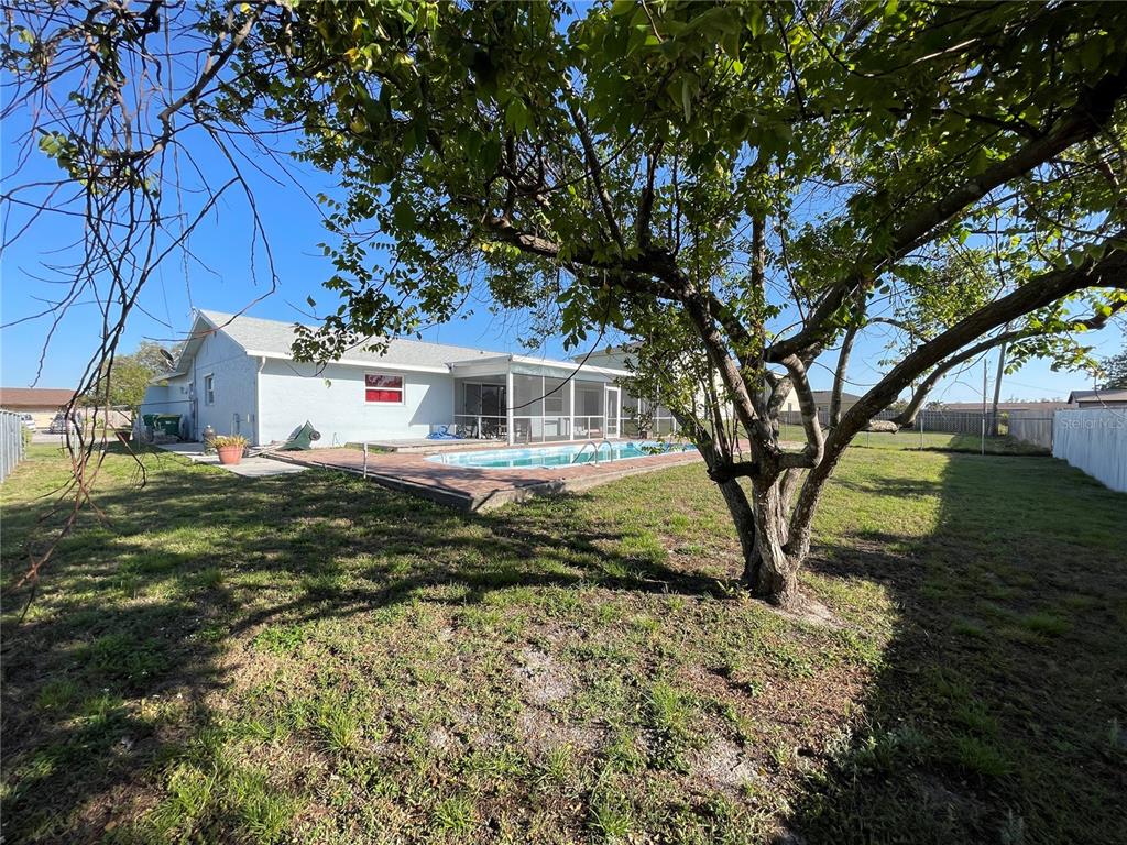 234 Shadow Street Northwest Port Charlotte, FL 33952 - Photo 40 of 48 a view of a house with a yard