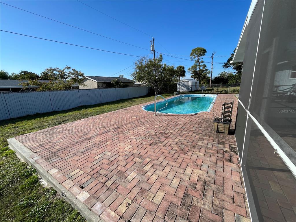 234 Shadow Street Northwest Port Charlotte, FL 33952 - Photo 46 of 48 a view of a terrace with a bench