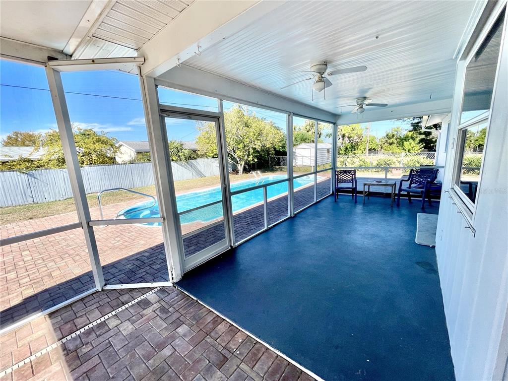 234 Shadow Street Northwest Port Charlotte, FL 33952 - Photo 47 of 48 a view of hallway with furniture and a porch