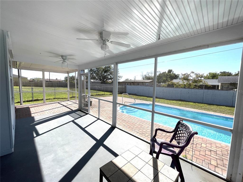 234 Shadow Street Northwest Port Charlotte, FL 33952 - Photo 10 of 48 a view of a swimming pool with a patio