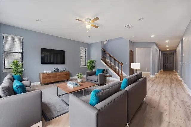 a living room with furniture and a flat screen tv