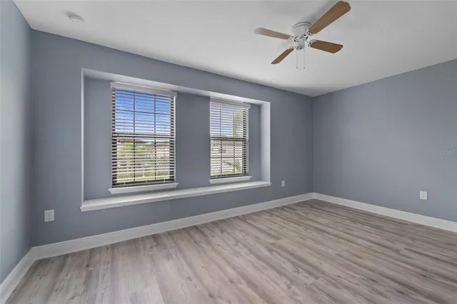 a bathroom with a double vanity sink toilet mirror and bathtub