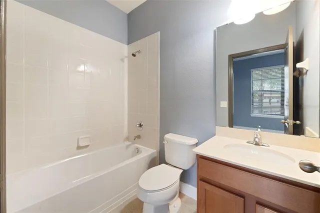 a kitchen with stainless steel appliances granite countertop a refrigerator a stove top oven a sink and dishwasher