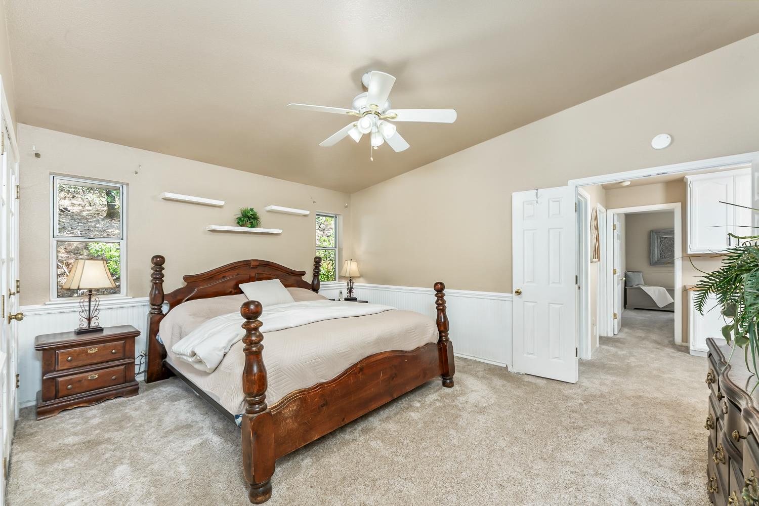 3472 See View Court Rescue, CA 95672 - Photo 17 of 37 a bedroom with a bed and a chandelier