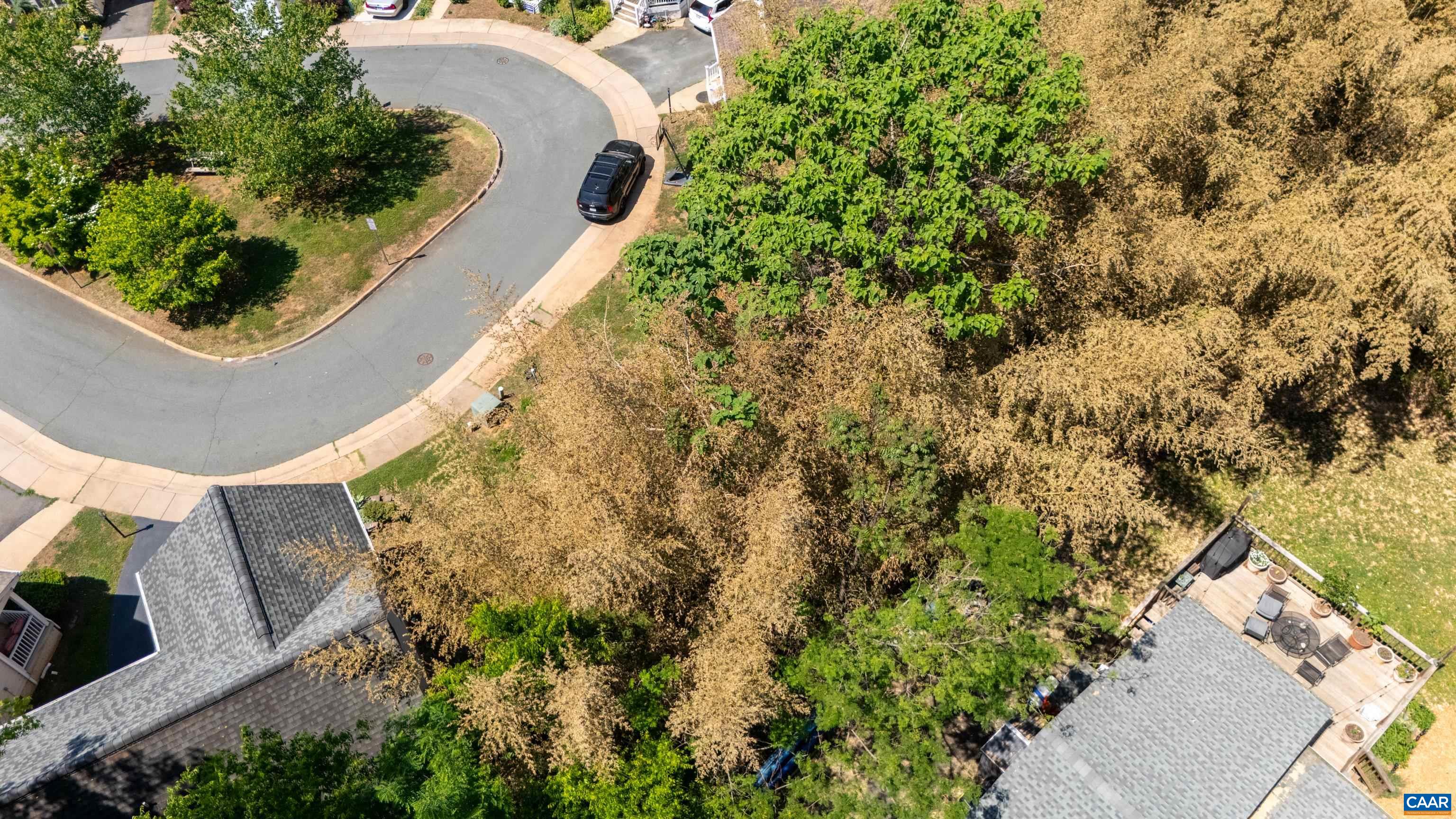 125 Roy's Place Charlottesville, VA 22902 - Photo 15 of 19 an aerial view of a house with a yard and lake view