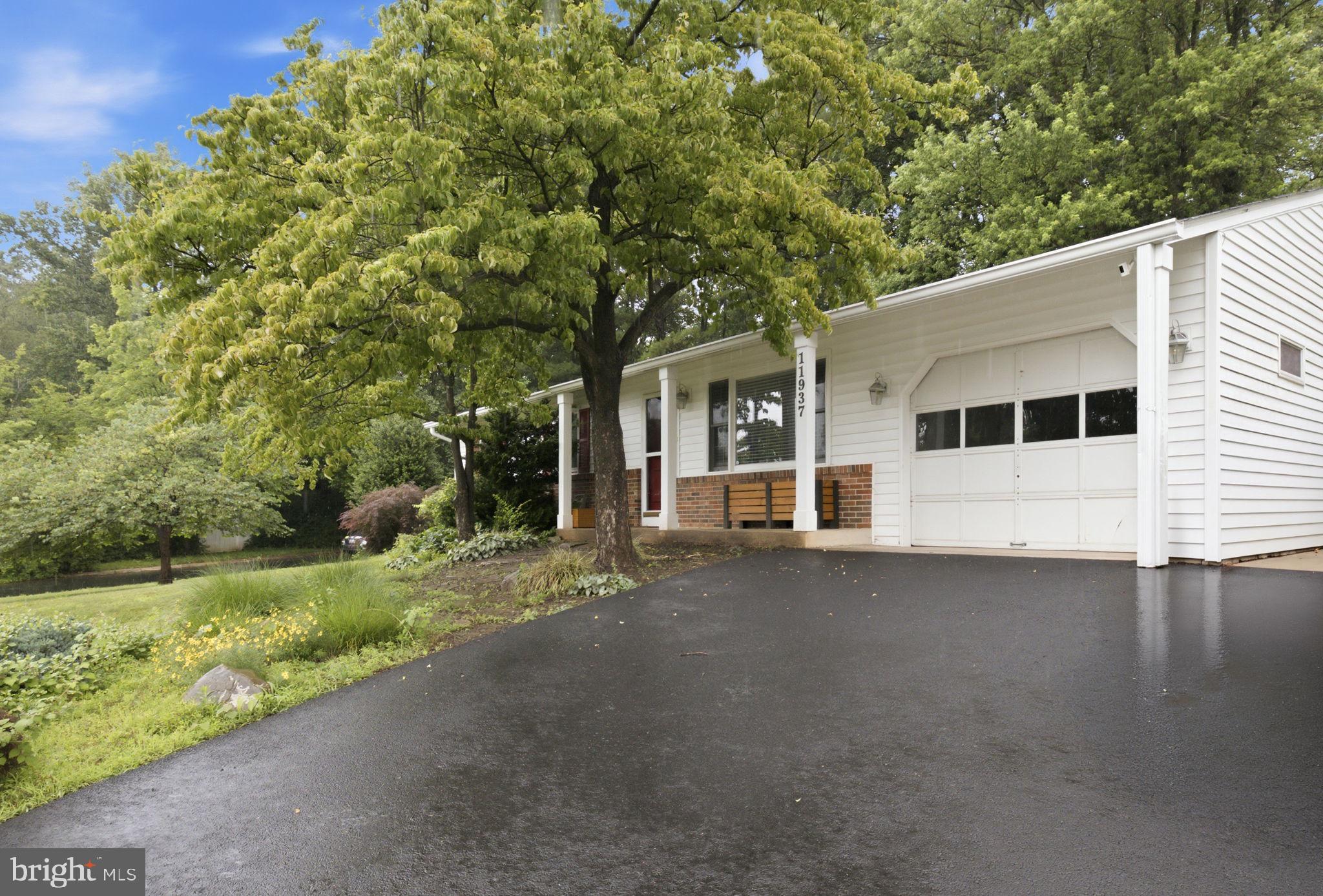 11937 Bayswater Road Gaithersburg, MD 20878 - Photo 4 of 55 Charming home with lush greenery.