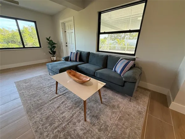 a living room with furniture and a window
