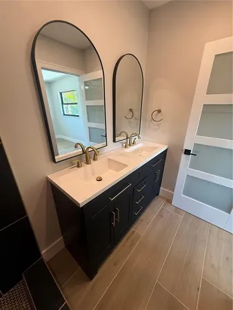 a bathroom with a sink and a mirror