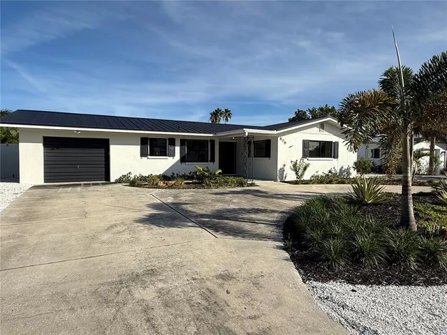 a front view of a house with yard