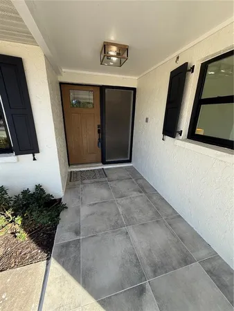 a view of entryway with a front door