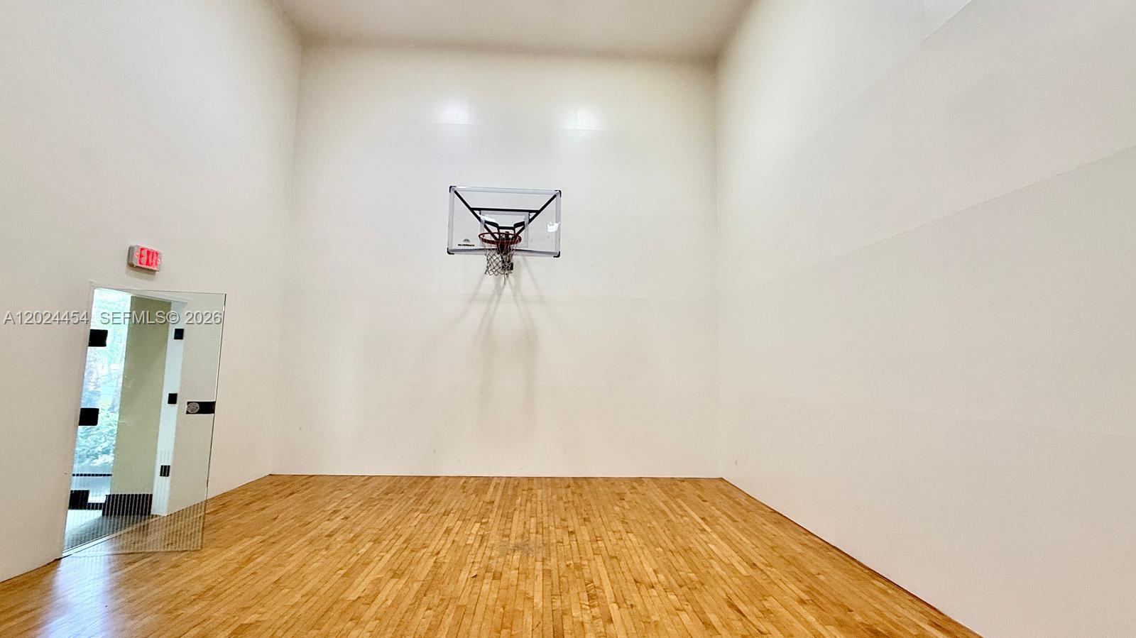 2727 Anzio Court, Unit 106 Palm Beach Gardens, FL 33410 - Photo 40 of 43 a view of empty room with wooden floor