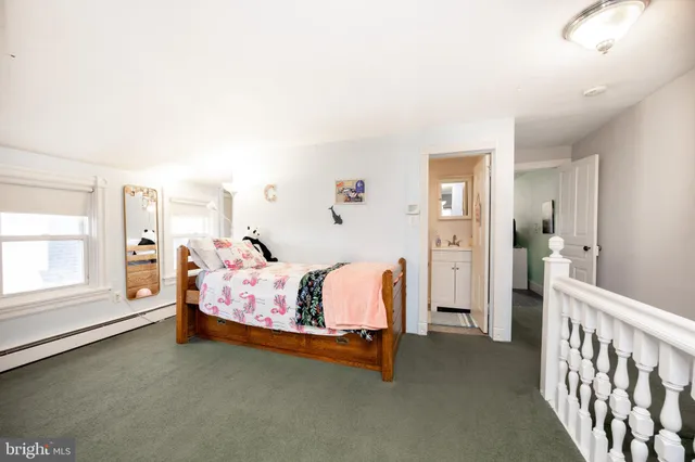 a bed room with a bed and a window