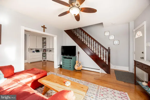 a bedroom with a bed and a view of kitchen