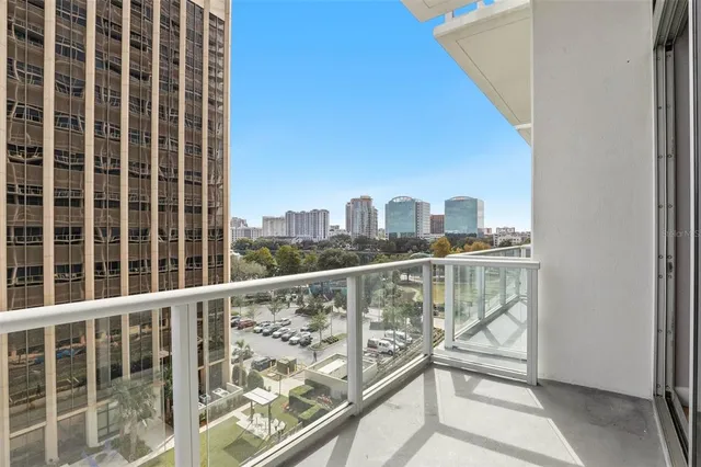 a view of a city skyline from a balcony