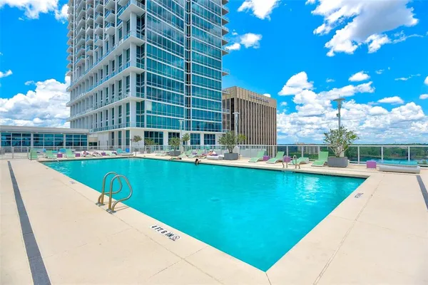a view of a swimming pool with a patio