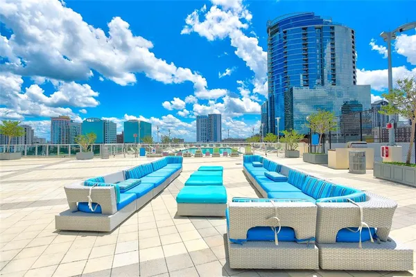 a view of a swimming pool with sitting area