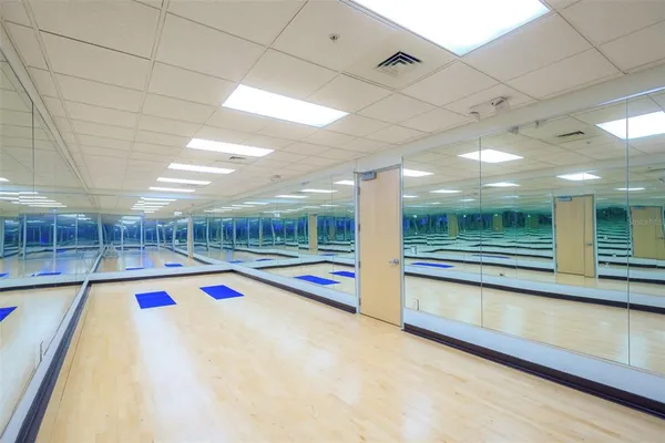 a view of a studio with wooden floor