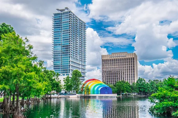 a view of building with outdoor space and lake view