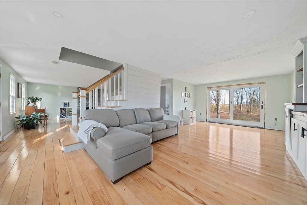 44 Jayna Way Marshfield, MA 02050 - Photo 11 of 27 a living room with furniture and a wooden floor