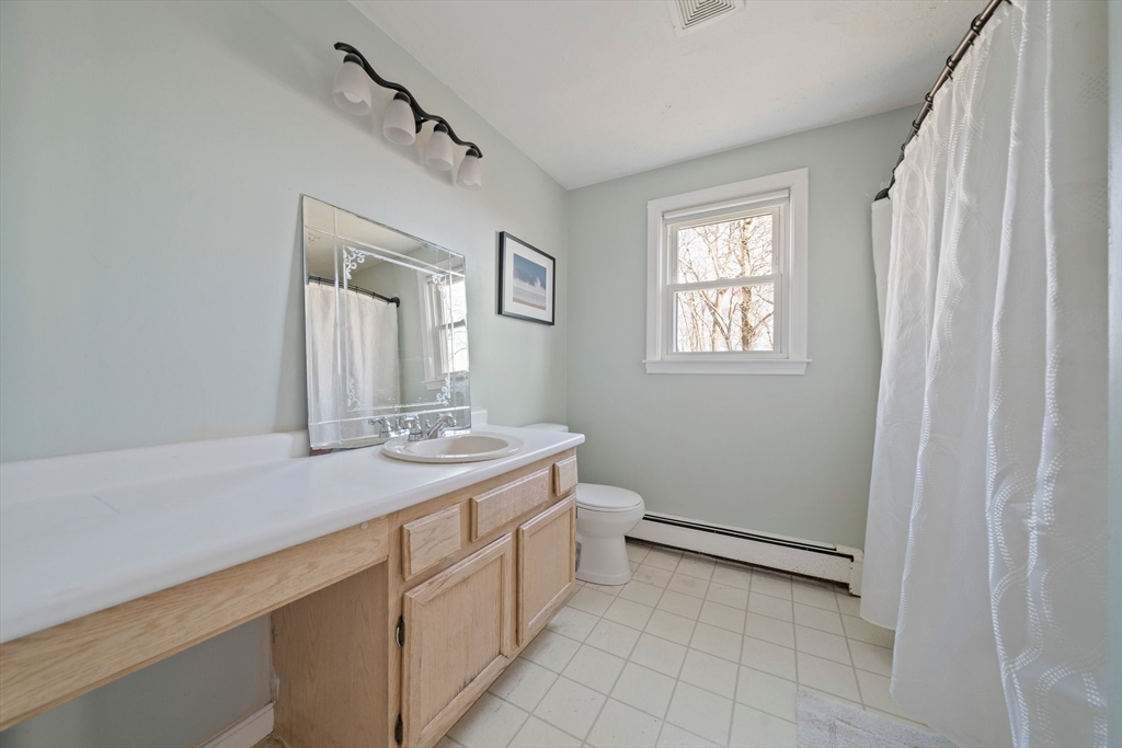 44 Jayna Way Marshfield, MA 02050 - Photo 14 of 27 a bathroom with a sink a vanity and a mirror