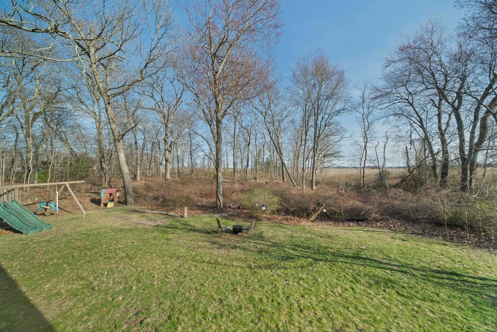 44 Jayna Way Marshfield, MA 02050 - Photo 17 of 27 a backyard of a house with lots of green space