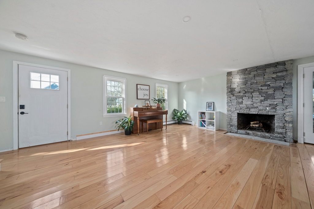 44 Jayna Way Marshfield, MA 02050 - Photo 4 of 27 a living room with furniture and a fireplace