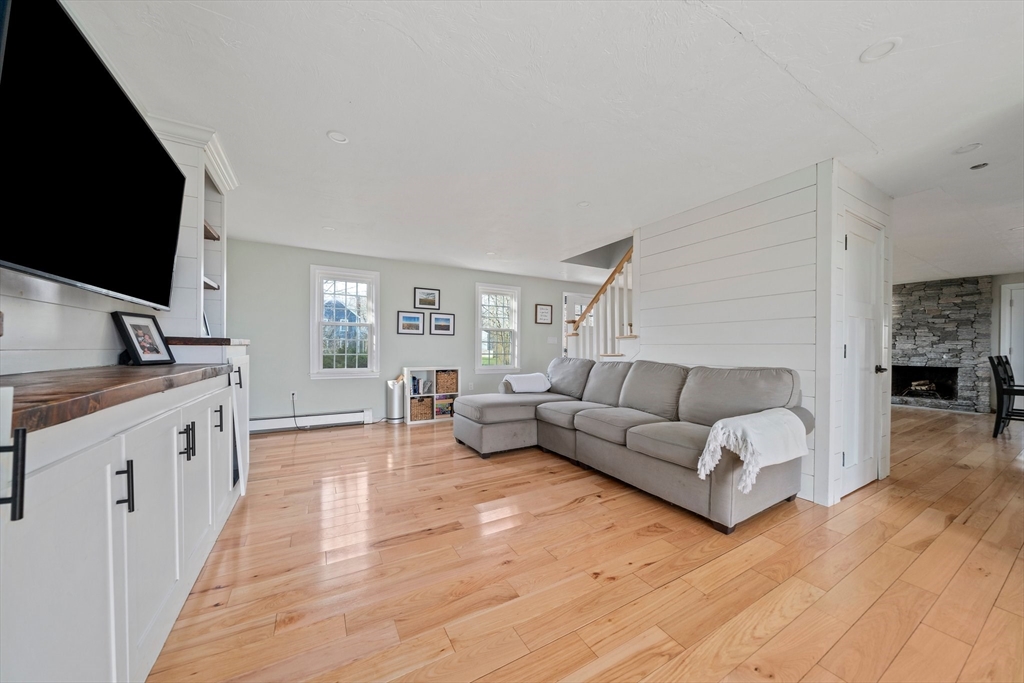 44 Jayna Way Marshfield, MA 02050 - Photo 10 of 27 a living room with furniture and a flat screen tv