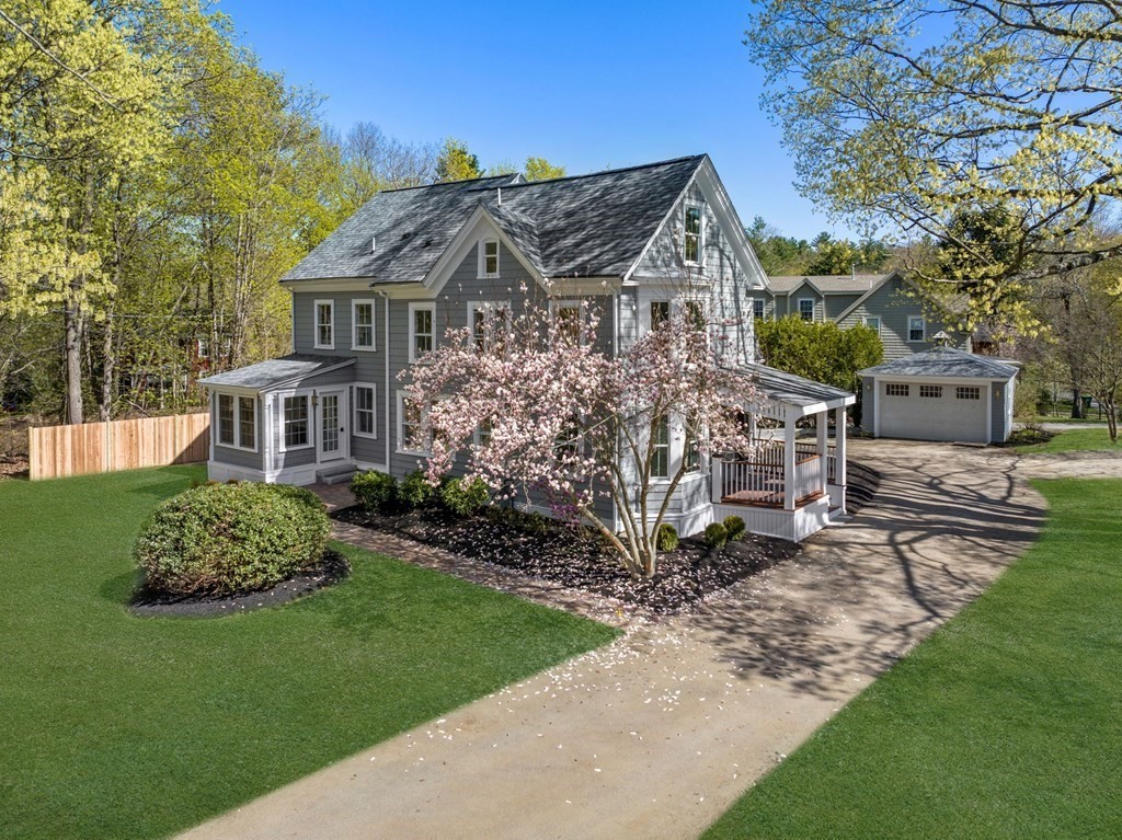 25 Conant Road Weston, MA 02493 - Photo 1 of 1 a front view of a house with a garden