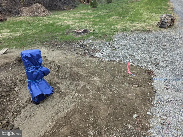 a view of a table and chairs in a yard