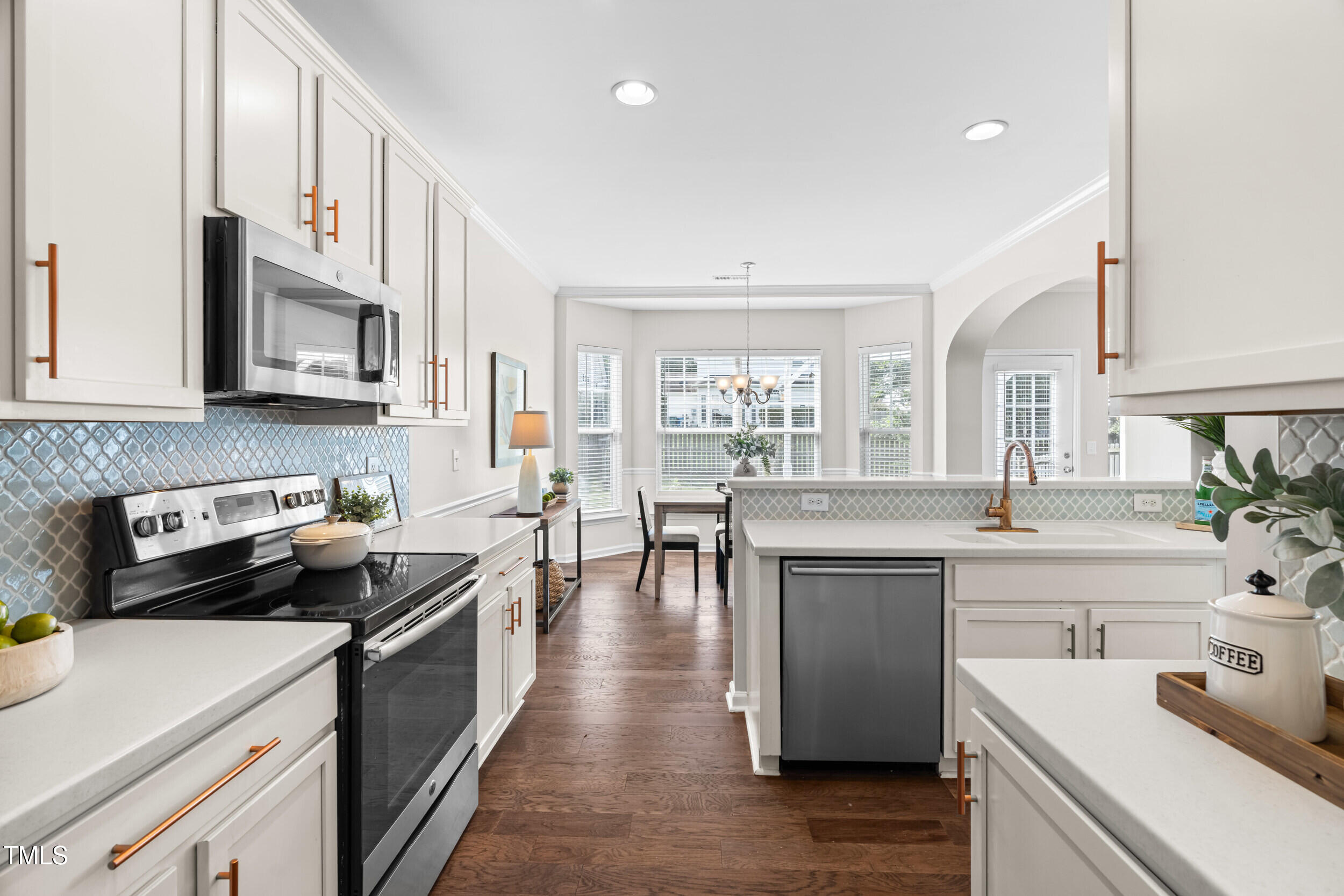 2816 Prospect Parkway Durham, NC 27703 - Photo 12 of 38 a kitchen with a sink stove and cabinets