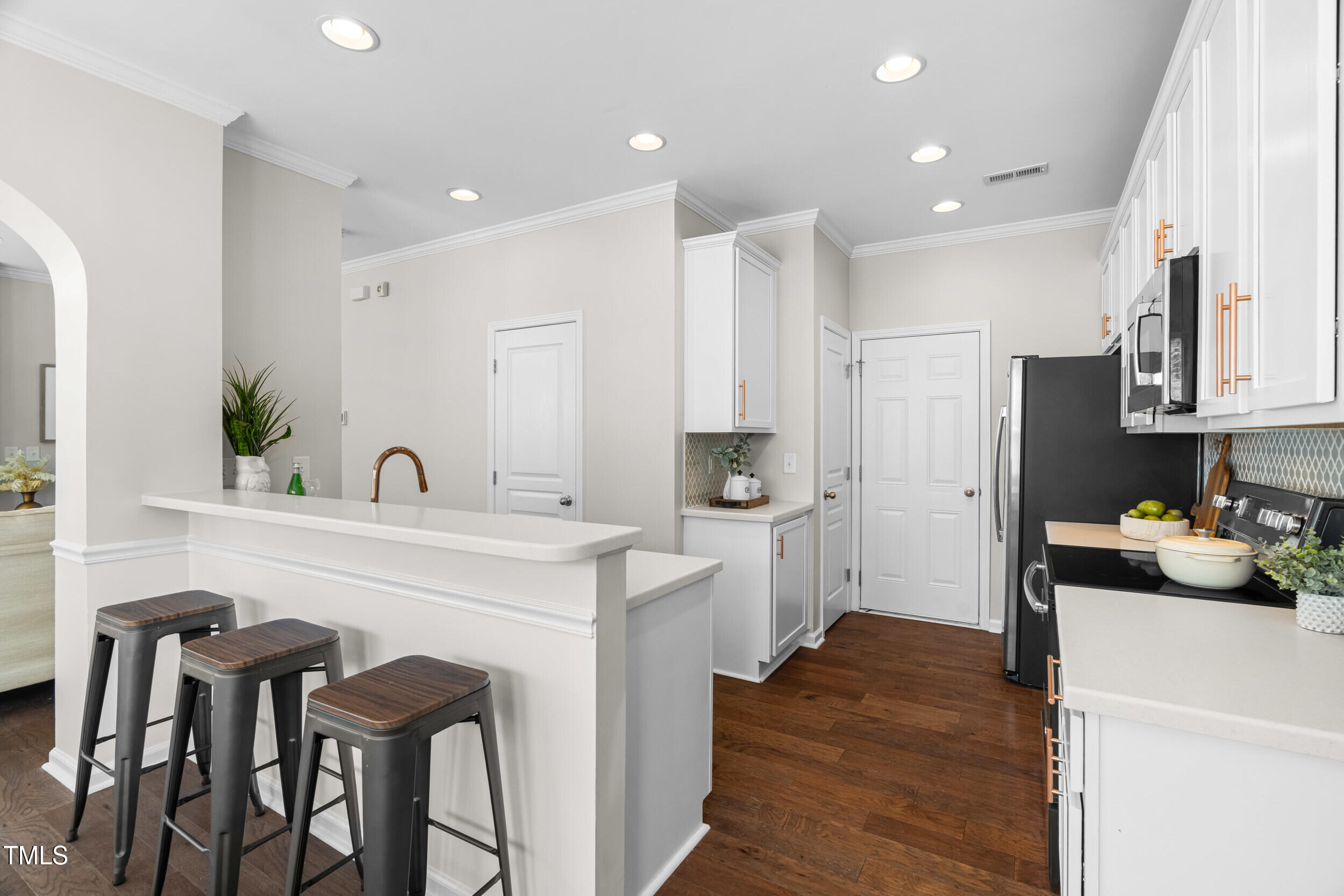 2816 Prospect Parkway Durham, NC 27703 - Photo 13 of 38 a kitchen with a sink and chairs