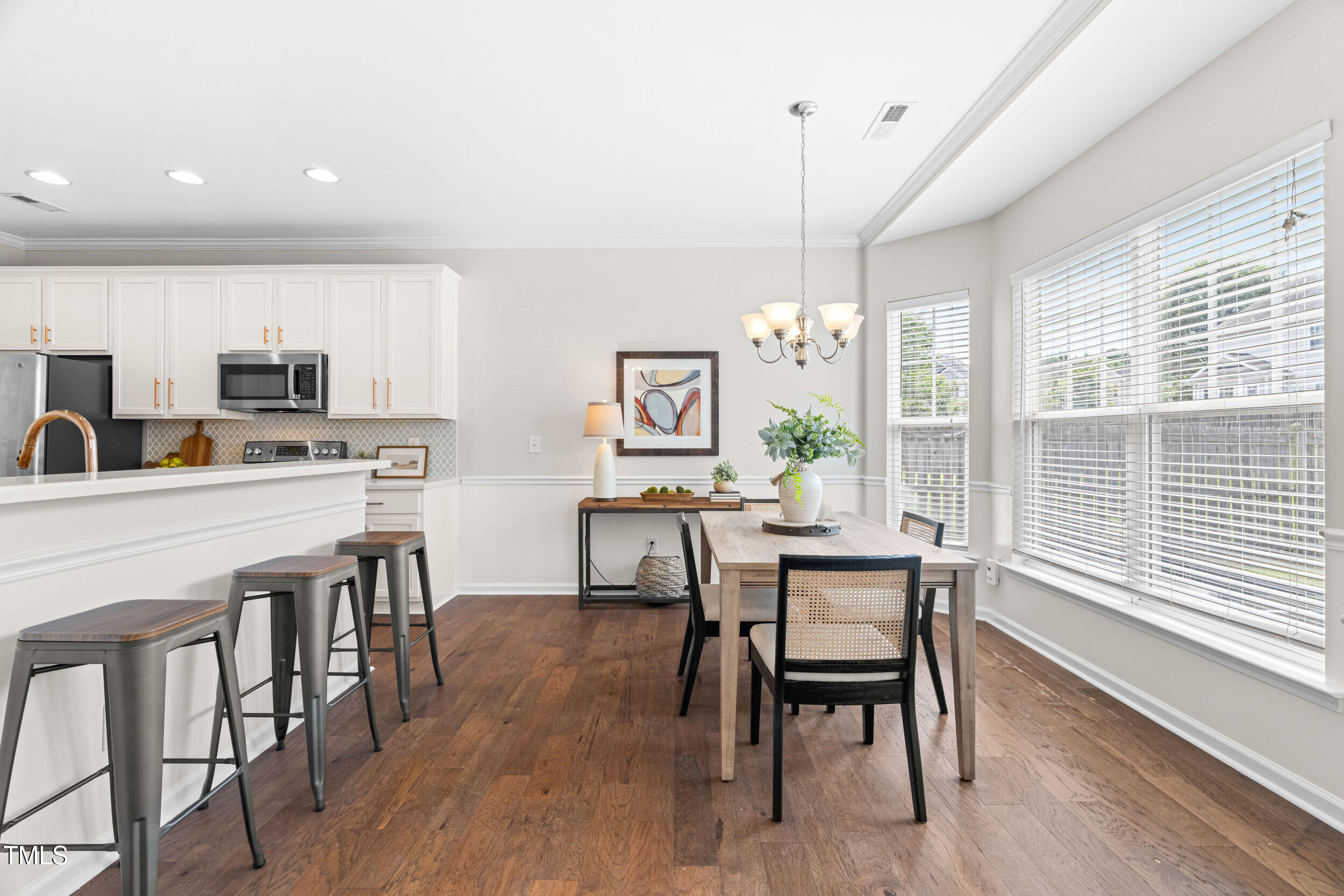 2816 Prospect Parkway Durham, NC 27703 - Photo 15 of 38 a view of a dining room with furniture window and wooden floor