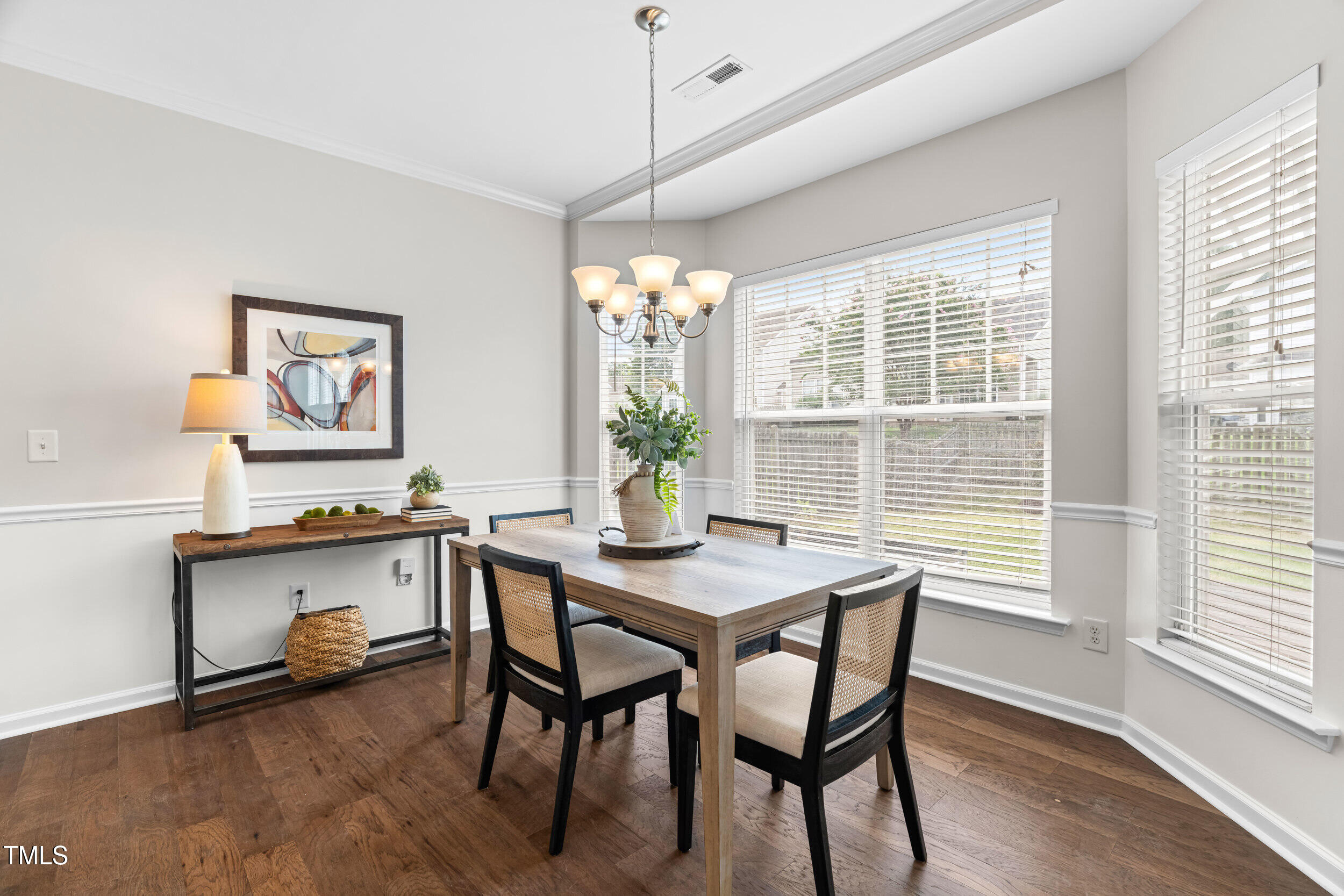 2816 Prospect Parkway Durham, NC 27703 - Photo 16 of 38 a view of a dining room with furniture window and wooden floor