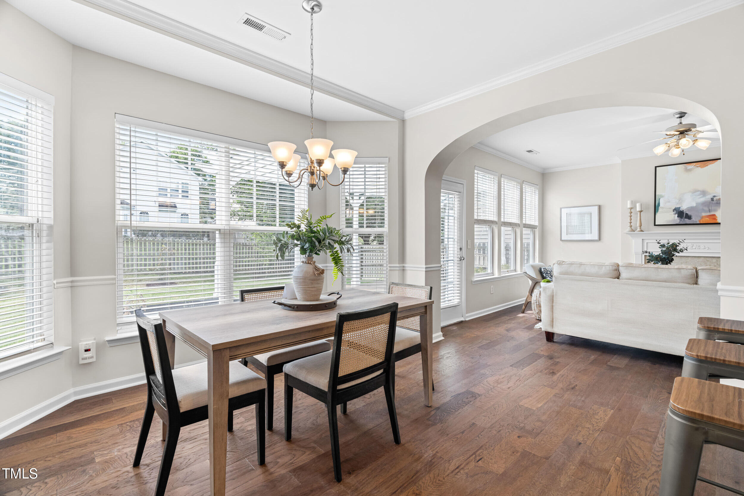 2816 Prospect Parkway Durham, NC 27703 - Photo 17 of 38 a dining room with furniture a chandelier and wooden floor